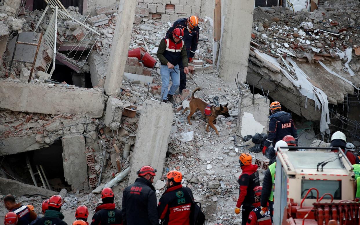 Rescue workers search the site of a collapsed building in Elazig following the January 24 earthquake - REUTERS