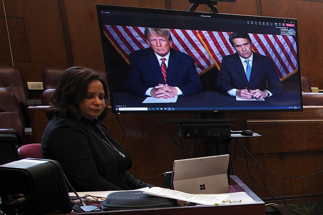 Former president Donald Trump appears by video conferencing before Justice Juan Merchan during a hearing regarding the criminal case against him over a hush money payment to porn star Stormy Daniels, in Manhattan state court on 23 May 2023 (via REUTERS)