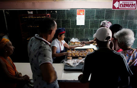 People wait in line to buy sweets in a state store in downtown Havana, Cuba, May 10, 2019. REUTERS/Alexandre Meneghini