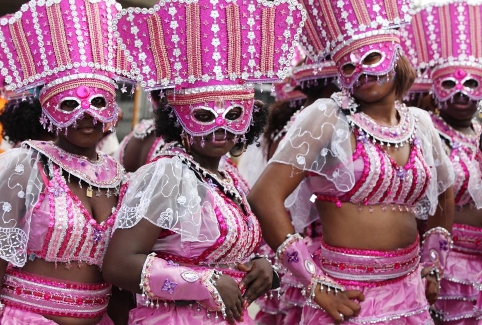 Performers walks through the street during Lagos Carnival in Lagos, Nigeria, Monday, April 1, 2013. Performers filled the streets of Lagos' islands Monday as part of the Lagos Carnival, a major festival in Nigeria's largest city during Easter weekend. (AP Photo/Sunday Alamba)