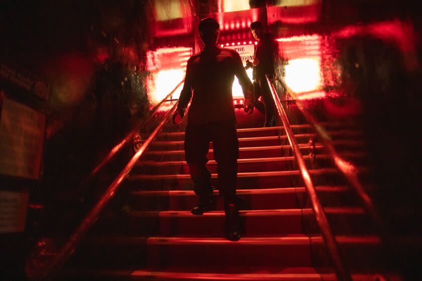 LOS ANGELES, CA - OCTOBER 21: Ghost hunter Zak Bagans, front, and Jay Wasley walk down after investigating a room at The Comedy Store which is long-reputed to be haunted. Photographed on Friday, Oct. 21, 2022 in Los Angeles, CA. (Myung J. Chun / Los Angeles Times)