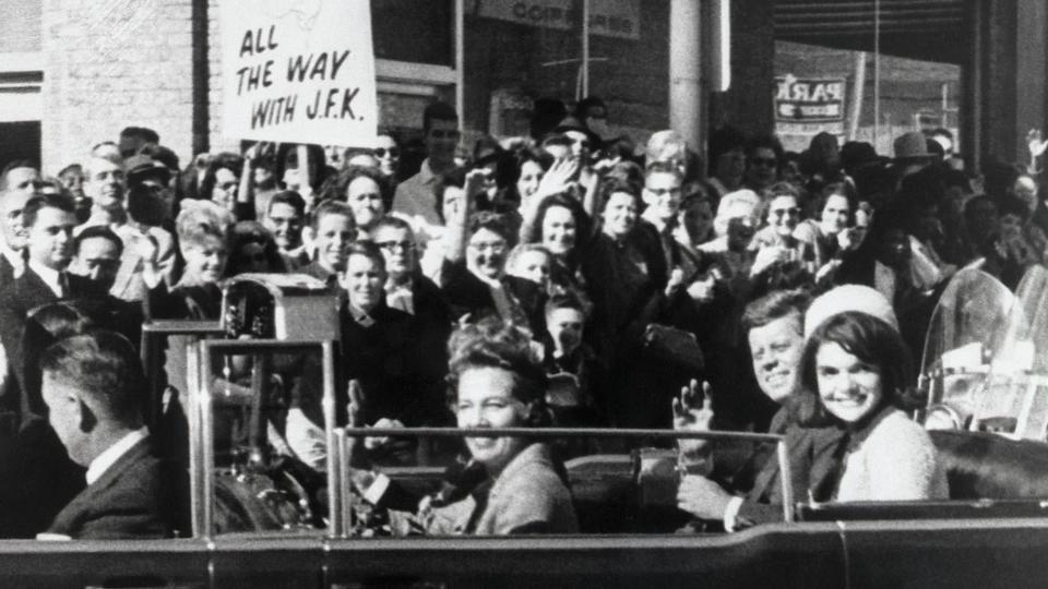 President Kennedy and wife Jackie ride in a motorcade among the crowds in Dallas on November 22, 1963. Moments later President Kennedy will be fatally shot. Texas Governor John Connally was also shot.