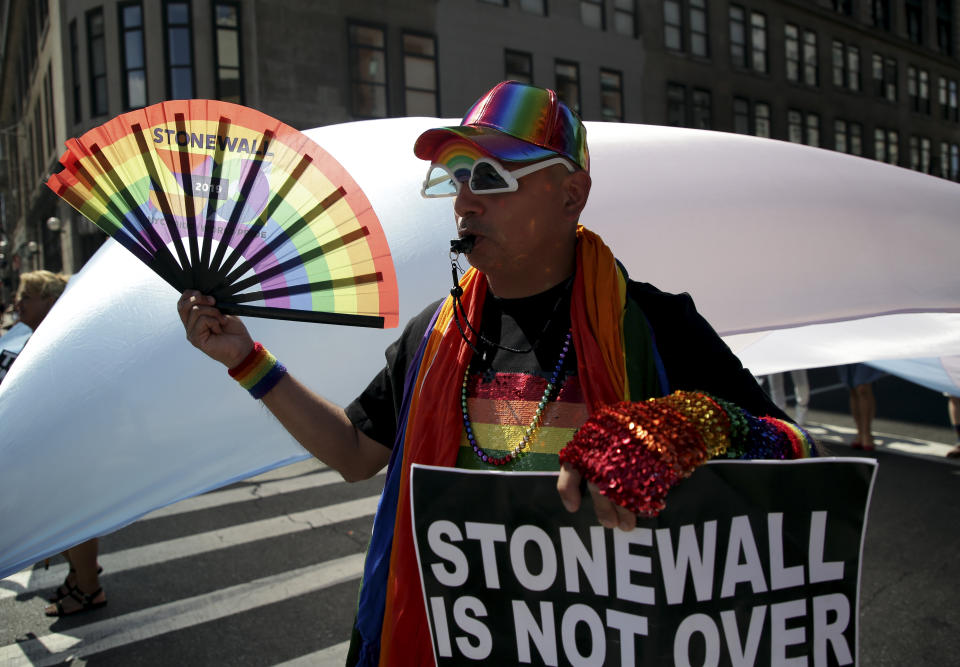 A participant marches in the Queer Liberation March in New York, Sunday, June 30, 2019. New York is throwing a massive LGBTQ Pride march as other cities including San Francisco, Chicago and Seattle also host parades commemorating the 50th anniversary of the clash between police and gay bar patrons that sparked the modern gay rights movement. The organizers of the smaller Queer Liberation March say the larger Pride event has become too commercialized and too heavily policed. (AP Photo/Seth Wenig)