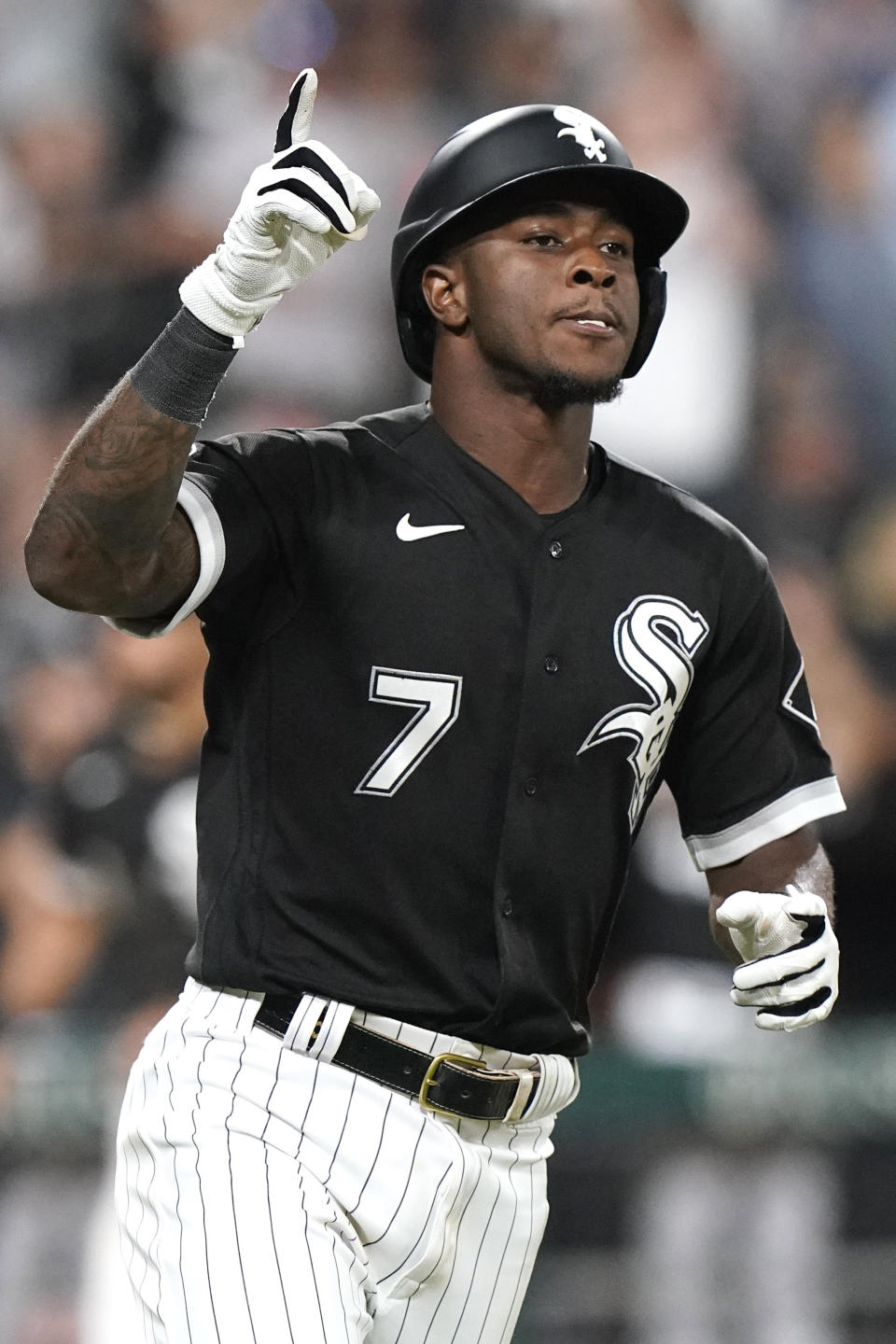 Chicago White Sox's Tim Anderson celebrates as he runs to first after hitting an RBI single during the eighth inning of the team's baseball game against the Cleveland Indians in Chicago, Friday, July 30, 2021. (AP Photo/Nam Y. Huh)