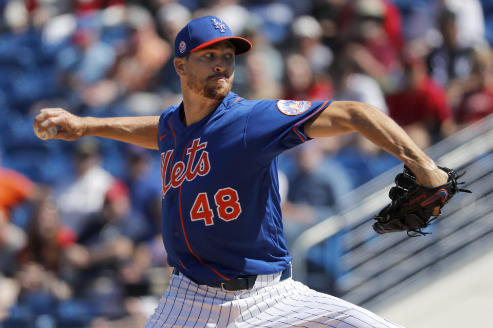 New York Mets pitcher Jacob deGrom throws during the first inning of a spring training baseball game against the Washington Nationals Sunday, March 1, 2020, in Port St. Lucie, Fla. (AP Photo/Jeff Roberson)