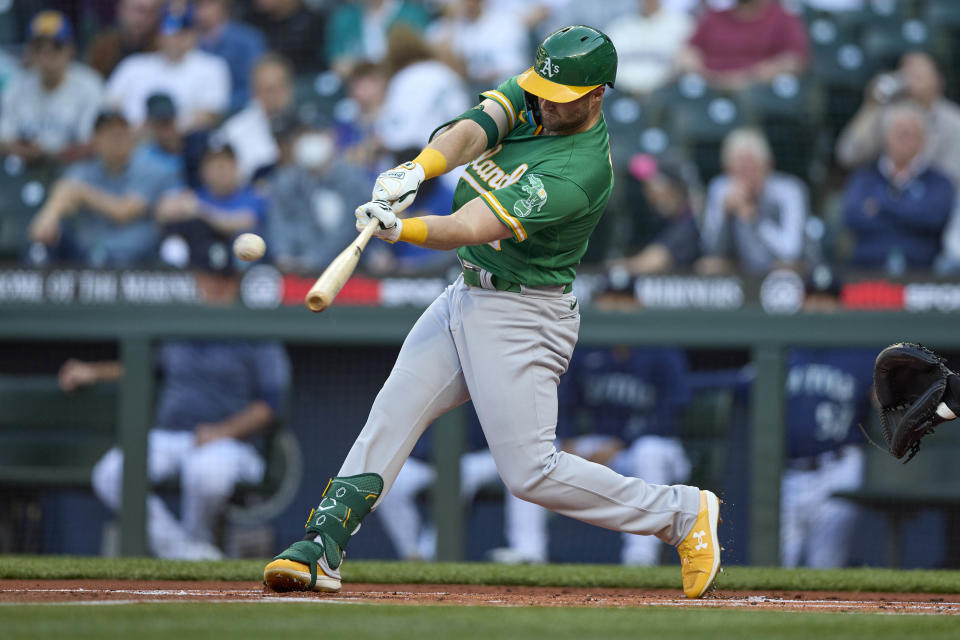 Oakland Athletics' Seth Brown hits a two-run home run on a pitch by Seattle Mariners starter Logan Gilbert during the first inning of a baseball game, Thursday, May 25, 2023, in Seattle. (AP Photo/John Froschauer)