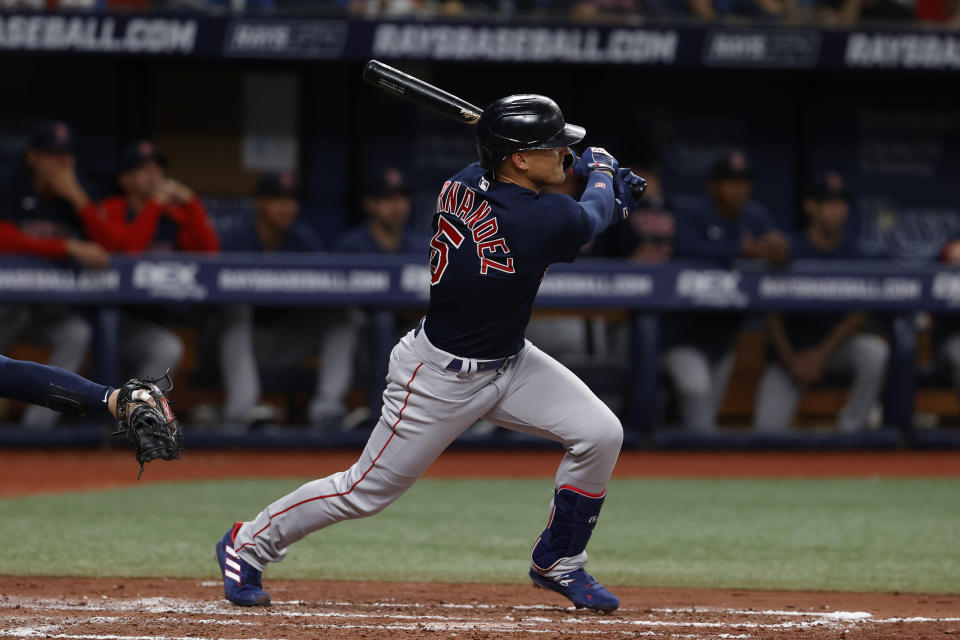 Boston Red Sox's Enrique Hernandez hits an RBI-single against the Tampa Bay Rays during a baseball game Friday, April, 22, 2022, in St. Petersburg, Fla. (AP Photo/Scott Audette)