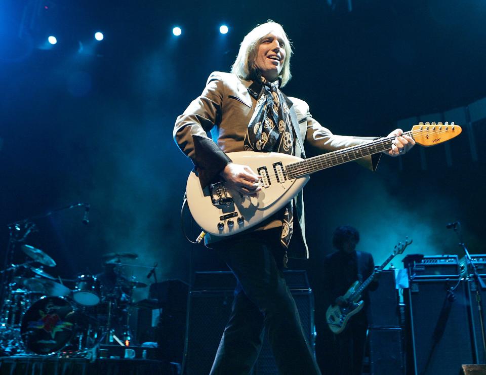 FILE - In this Oct. 4, 2006 file photo, singer Tom Petty performs in Glendale, Ariz. Petty has died at age 66. Spokeswoman Carla Sacks says Petty died Monday night, Oct. 2, 2017, at UCLA Medical Center in Los Angeles after he suffered cardiac arrest. (AP Photo/Matt York, File) ORG XMIT: NYET153