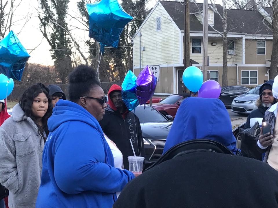 Juanita Steele (left) speaking about her son, Donnell Steele, during the one-year anniversary of his death on Feb. 18, 2022.