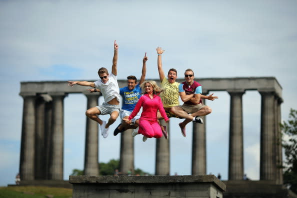 Members of the InSTEP theatre group take part in a photocall on Calton Hill to promote their show at the Edinburgh Fringe, 'Departure Lounge,' on August 6, 2012 in Edinburgh, Scotland. The Edinburgh Festival Fringe is the largest arts festivals in the world, it was established as an alternative to the International Festival also held in August, and celebrates it's 66th anniversary this year. (Photo by Dan Kitwood/Getty Images)