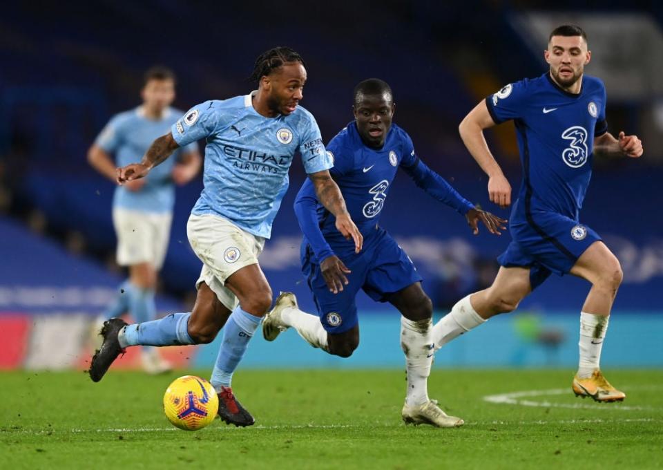 Raheem Sterling runs with the ball whilst under pressure from N’Golo Kante (Getty)