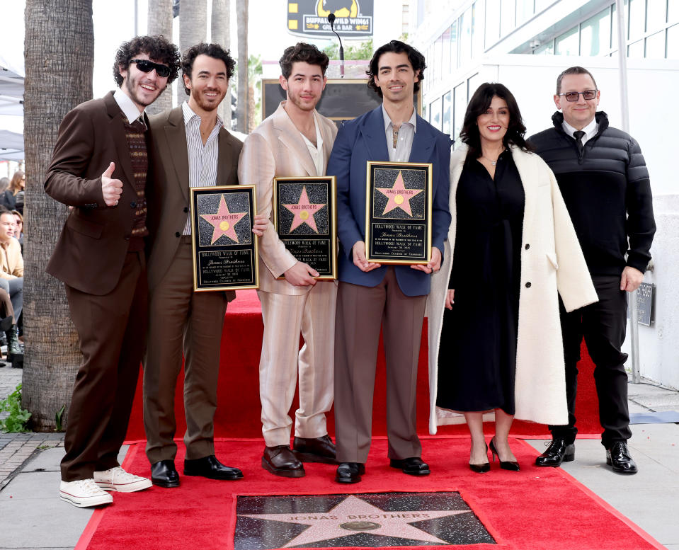 HOLLYWOOD, CALIFORNIA - JANUARY 30: (Second from L-R) Kevin Jonas, Nick Jonas, and Joe Jonas of The Jonas Brothers, and (L-R) Frankie Jonas, Denise Miller-Jonas, and Paul Kevin Jonas Sr. attend The Hollywood Walk of Fame star ceremony honoring The Jonas Brothers on January 30, 2023 in Hollywood, California. (Photo by Amy Sussman/Getty Images)