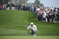 Tiger Woods lines up a putt on the second hole of the South Course at Torrey Pines Golf Course during the second round of the Farmers Insurance golf tournament Friday Jan. 24, 2020, in San Diego. (AP Photo/Denis Poroy)