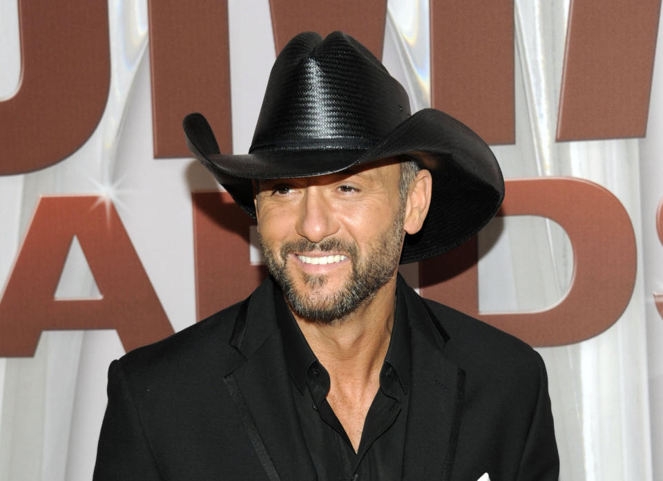 FILE - In this Nov. 9, 2011 file photo, country singer Tim McGraw arrives at the 45th Annual CMA Awards in Nashville, Tenn. McGraw and Miranda Lambert are the top nominees for this year's Academy of Country Music Awards. Lambert and McGraw are up for seven awards apiece at the April 6 awards show. The nominations were announced Wednesday morning in a series of videos via social media. (AP Photo/Evan Agostini, file)