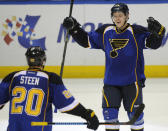 St. Louis Blues' Vladimir Tarasenko (91), of Russia, celebrates with teammate Alexander Steen (20) after his game-tying goal against the Chicago Blackhawks during the third period in Game 2 of a first-round NHL hockey playoff series, Saturday, April 19, 2014, in St. Louis. (AP Photo/Bill Boyce)