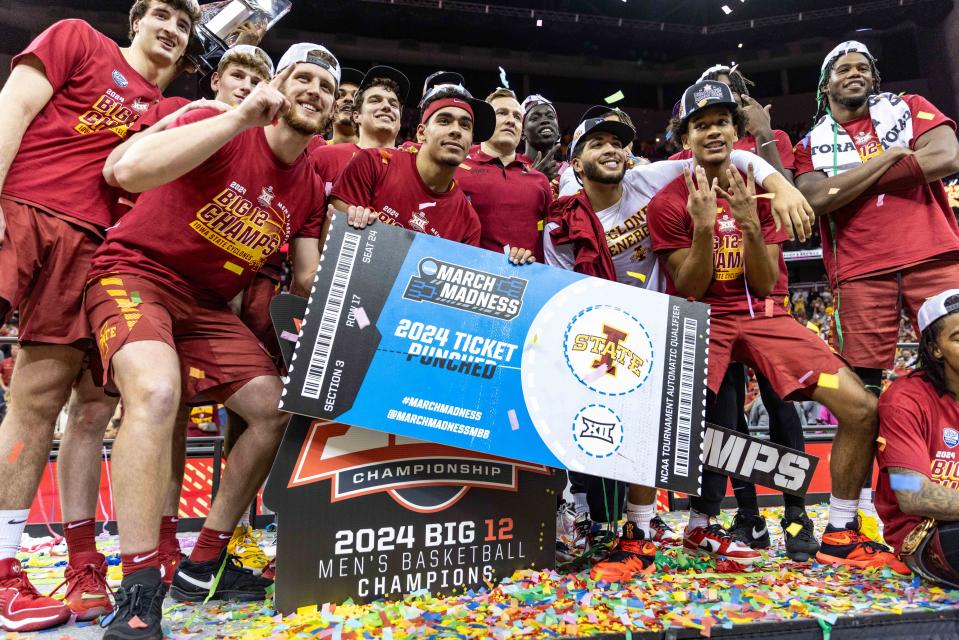 The Iowa State Cyclones hold their ticket to the NCAA Tournament after the Big 12 Tournament title game victory over the Houston Cougars at T-Mobile Center on Saturday.