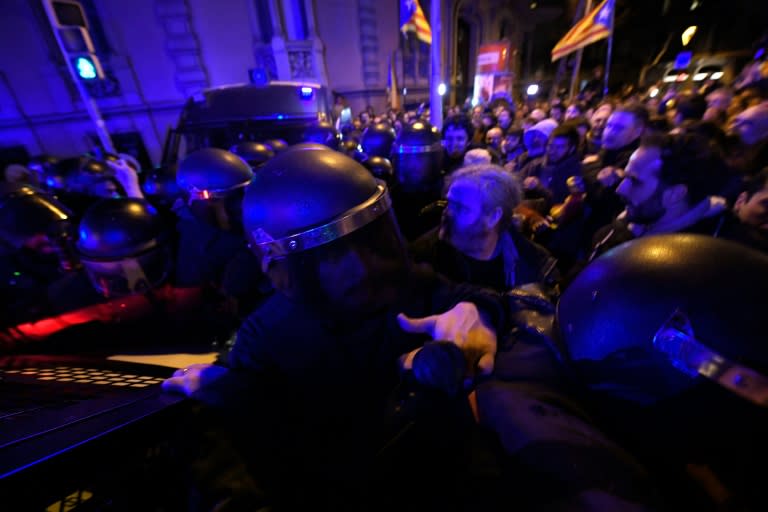 Demonstrators scuffle with riot police in Barcelona during a protest called by supporters of Catalan independence