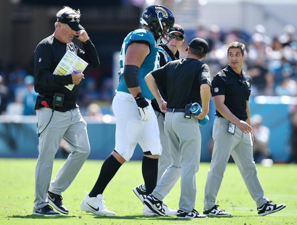 Jacksonville Jaguars guard Brandon Scherff (68) is given attention as he walks off the field after a second quarter injury. The Jacksonville Jaguars hosted the Indianapolis Colts at EverBank Stadium in Jacksonville, FL Sunday, October 15, 2023. The Jaguars ended the first half with a 21 to 6 lead. [Bob Self/Florida Times-Union]