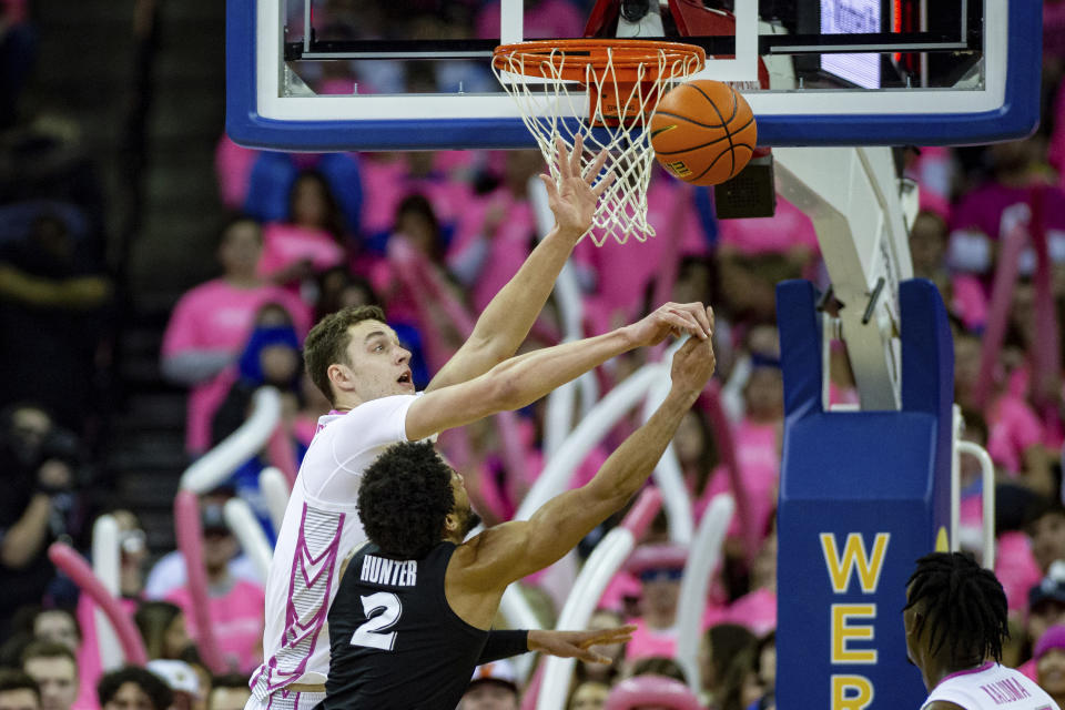 Creighton's Ryan Kalkbrenner (11) blocks a shot by Xavier's Jerome Hunter (2) in the second half during an NCAA college basketball game Saturday, Jan. 28, 2023, in Omaha, Neb. (AP Photo/John Peterson)