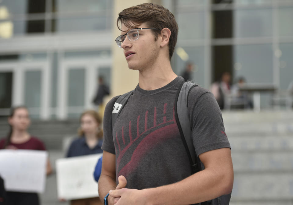 Brad Weisman, a senior in exercise science, talks to other students about Jerry Falwell Jr.'s behavior during a student protest Liberty University in Lynchburg, September 13, 2019."I'm afraid to protest here," he said. (Taylor Irby/The News & Advance via AP)