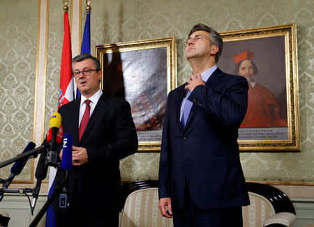 Croatia's new Prime Minister Andrej Plenkovic (R) is pictured next to former Prime Minister Tihomir Oreskovic in the government building in Zagreb, October 19, 2016. REUTERS/Antonio Bronic