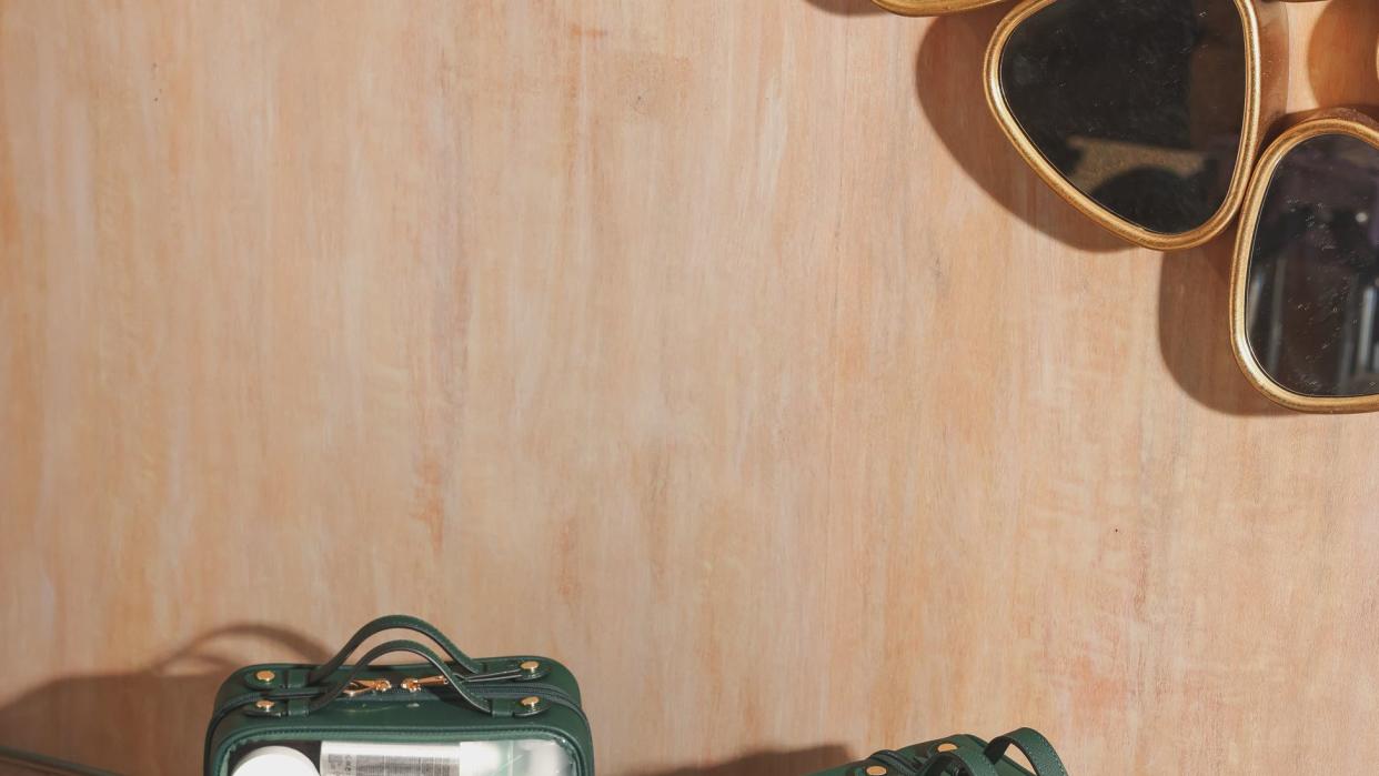 a group of green suitcases on a counter