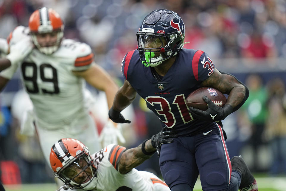 Houston Texans running back Dameon Pierce avoids a tackle during the first half of an NFL football game between the Cleveland Browns and Houston Texans in Houston, Sunday, Dec. 4, 2022,. (AP Photo/Eric Gay)