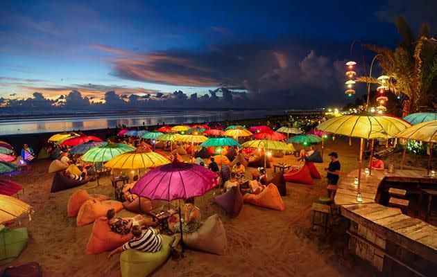 Relax on a bean bag on the beach in Seminyak, Bali. Photo: Getty