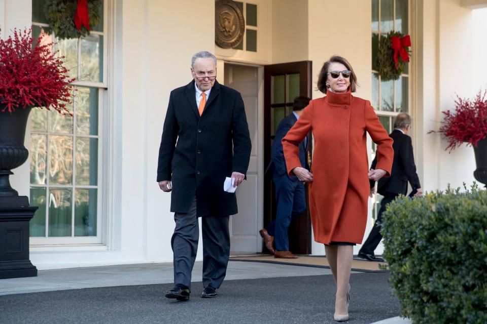 House Minority Leader Nancy Pelosi of Calif., right, and Senate Minority Leader Sen. Chuck Schumer of N.Y., left, walk out of the West Wing to speak to members of the media outside of the White House in Washington, Tuesday, Dec. 11, 2018, following a meeting with President Donald Trump.