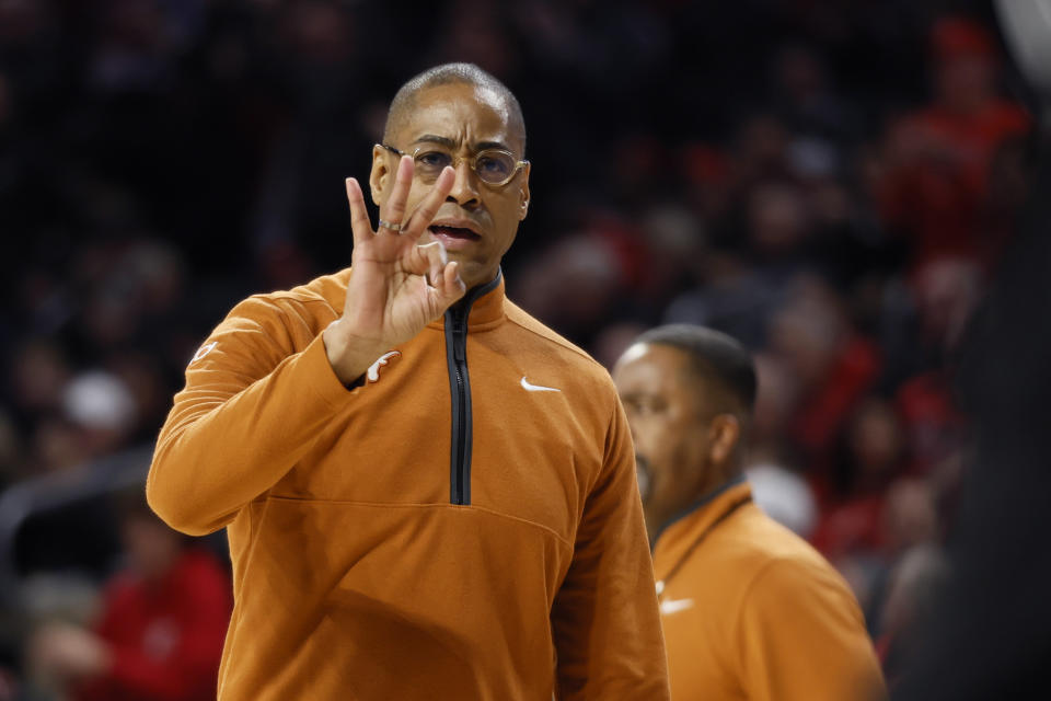 Texas coach Rodney Terry signals to the team during the first half of an NCAA college basketball game against Cincinnati on Tuesday, Jan. 9, 2024, in Cincinnati. (AP Photo/Jay LaPrete)