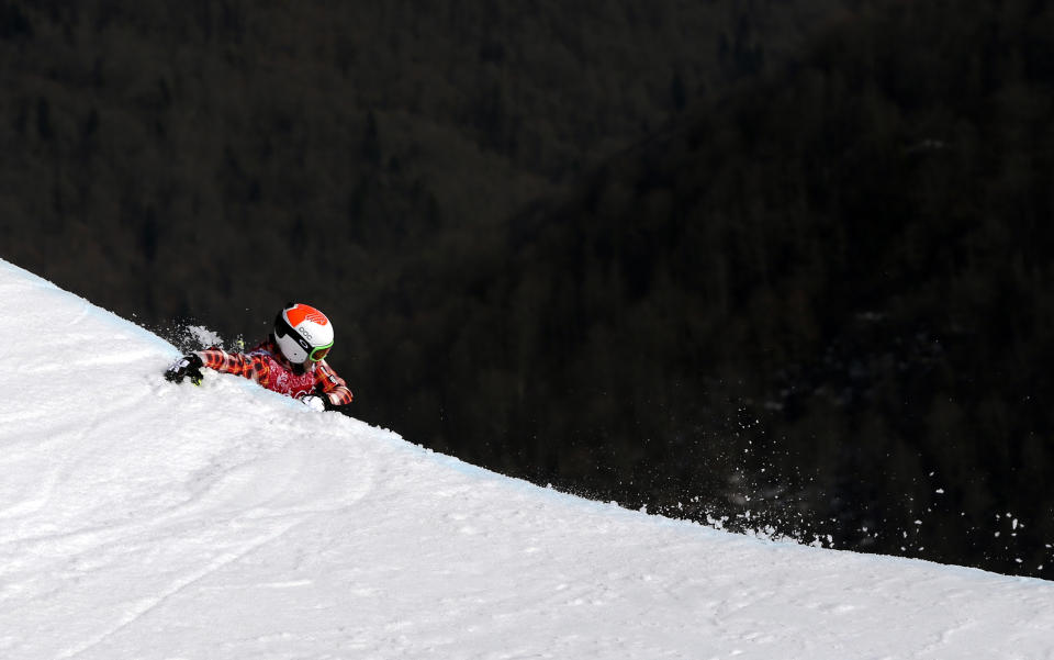 Canada's Brady Leman falls off a jump after crashing in the men's ski cross final at the Rosa Khutor Extreme Park at the 2014 Winter Olympics, Thursday, Feb. 20, 2014, in Krasnaya Polyana, Russia. (AP Photo/Sergei Grits)