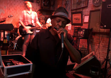 Blues man Vince Johnson plays harmonica at Blues Hall on Beale Street in Memphis, Tennessee, U.S., October 3, 2018. REUTERS/Sharon Bernstein