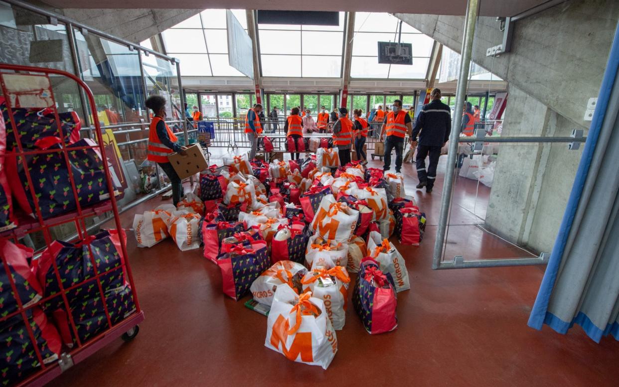 A food bank has been set up in one of Geneva's ice rinks during the coronavirus crisis - Getty Images