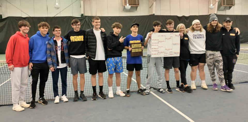 The Ontario Warriors celebrate their one-point win over Marion Harding for the Mid-Ohio Athletic Conference tournament championship.