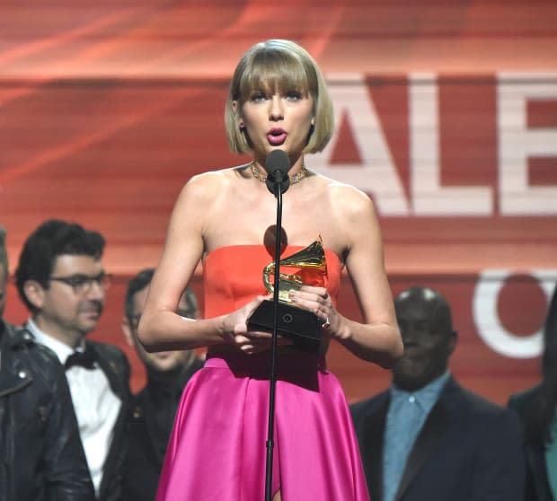 <p> Taylor Swift accepts the Album of the Year award onstage at the Grammys on Feb. 15, 2016. She alluded to her feud with<strong> <a href="https://parade.com/1335054/rose-maura-lorre/kanye-west-quotes/" rel="nofollow noopener" target="_blank" data-ylk="slk:Kanye West;elm:context_link;itc:0;sec:content-canvas" class="link ">Kanye West</a> </strong>in her speech, telling the crowd, "As the first woman to win Album of the Year at the Grammys twice, I want to say to all the young women out there, there are going to be people along the way who will try to undercut your <a href="https://parade.com/living/success-quotes" rel="nofollow noopener" target="_blank" data-ylk="slk:success;elm:context_link;itc:0;sec:content-canvas" class="link ">success</a> or take credit for your accomplishments or your fame, but, if you just focus on the work and you don't let those people sidetrack you, someday when you get where you're going you'll look around and you will know that it was you and the people who love you who put you there. And that will be the greatest feeling in the world. Thank you for this moment."</p><p>At the time, she also was the only woman on the stage, as her collaborators for <em>1989 </em>were all men.</p><p>Kevin Mazur/WireImage</p>