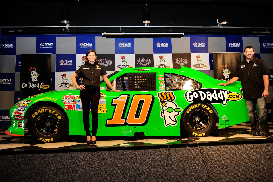 FORT WORTH, TX - NOVEMBER 04: Danica Patrick unveils her #10 GoDaddy.com Chevrolet for the 2012 season with team owner Tony Stewart following practice for the NASCAR Sprint Cup Series AAA Texas 500 at Texas Motor Speedway on November 4, 2011 in Fort Worth, Texas. (Photo by John Harrelson/Getty Images for NASCAR)