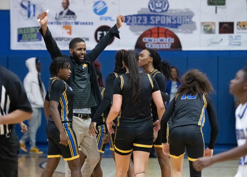 The Buccaneers celebrate their 56-53 victory in the Mainland vs Washington girls 5A Regional Finals basketball game at Booker T. Washington High School in Pensacola on Thursday, Feb. 22, 2024.