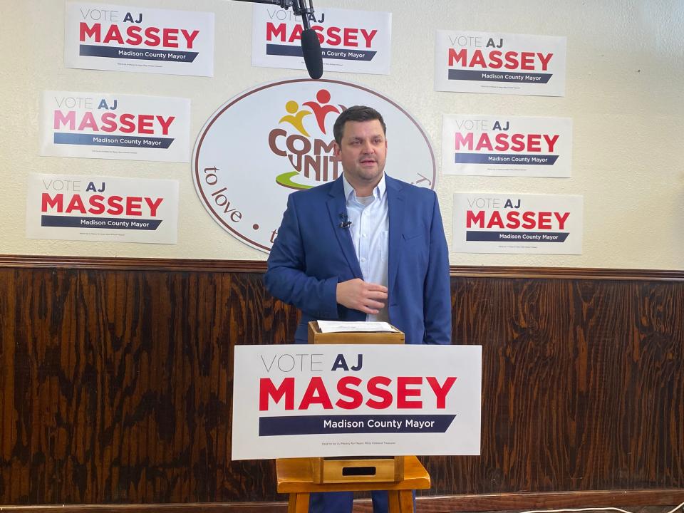 Mayoral candidate AJ Massey speaks to a crowd gathered at the ComeUnity Cafe Wednesday afternoon to announce his campaign.