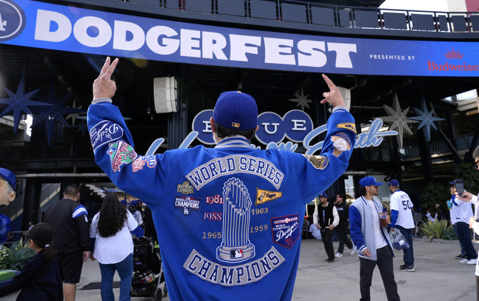 Dedicated Dodger fan Miguel Garcia from Long Beach, Calif. poses for a photo with his World Series jacket DodgerFest at Dodger Stadium on Saturday, Feb. 3, 2024 in Los Angeles. (AP Photo/Richard Vogel)