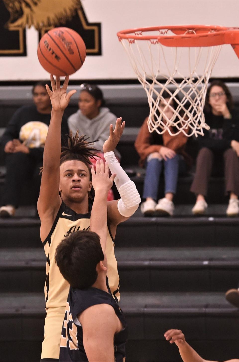 Abilene High's DeMarco Upshaw shoots over an El Paso Coronado defender in the second half. AHS beat Coronado 63-24 on Day 1 of the Raising Cane's Key City Classic on Thursday at Eagle Gym.