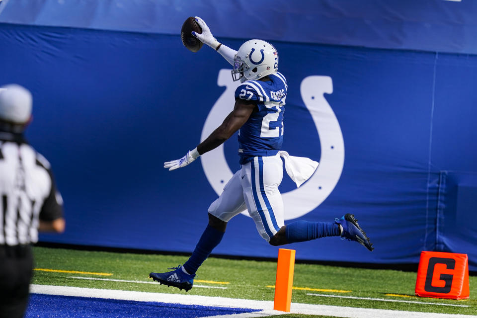 Indianapolis Colts cornerback Xavier Rhodes (27) runs back an interception for a touchdown against the New York Jets In the first half of an NFL football game in Indianapolis, Sunday, Sept. 27, 2020. (AP Photo/Darron Cummings)