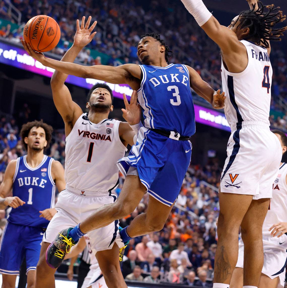 Duke’s Jeremy Roach (3) drives to the basket past Virginia’s Jayden Gardner (1) and Armaan Franklin (4) during the second half of Duke’s 59-49 victory over Virginia to win the ACC Men’s Basketball Tournament in Greensboro, N.C., Saturday, March 11, 2023.