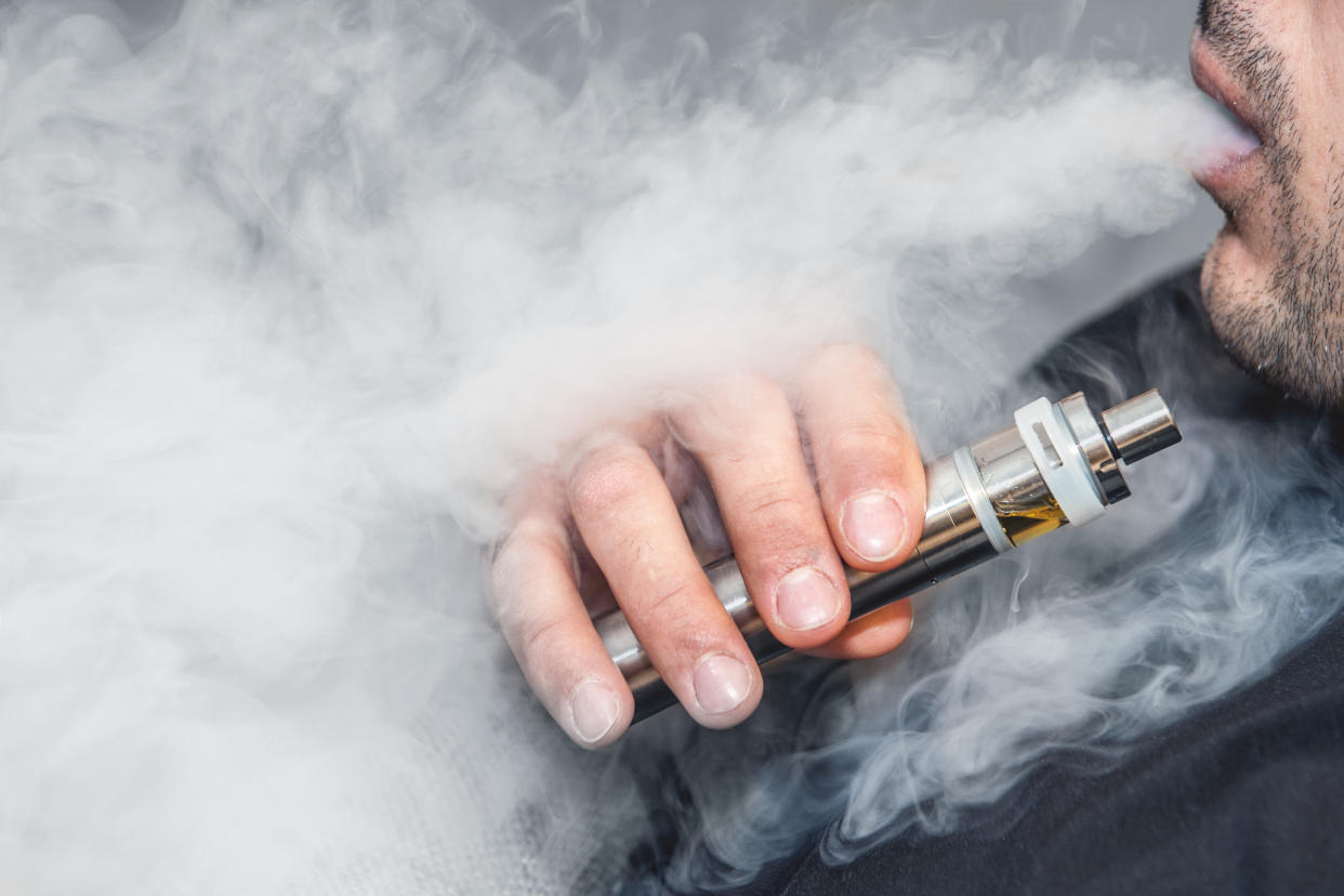 A man smoking an e-cigarette. (PHOTO: Getty Images)