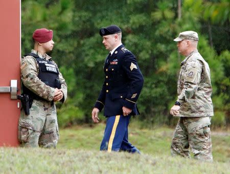 Sgt. Robert B. Bergdahl (C) is escorted into the court house after a lunch break during his hearing in the case of United States vs. Bergdahl in Fort Bragg, North Carolina, U.S., October 16, 2017. REUTERS/Jonathan Drake