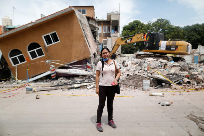 <p>Ana Maria Hernandez, 37, a clothing salesperson, poses for a portrait outside her house as it is demolished after an earthquake in Jojutla de Juarez, Mexico, September 30, 2017. Her house was badly damaged. Hernandez is living with relatives and hopes to return home once it is rebuilt. “I lost everything. My aunt died here,” she said. (Photo: Edgard Garrido/Reuters) </p>