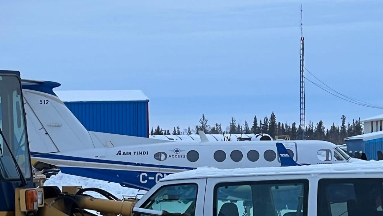 An Air Tindi plane lands at the Yellowknife airport Thursday afternoon after a successful effort by the airline and Search and Rescue to rescue 10 people who were stranded when a plane went down north of Yellowknife. (Travis Burke/CBC - image credit)