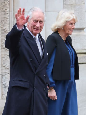 <p>Chris Jackson/Getty Images</p> King Charles III waves as he departs with Queen Camilla after receiving treatment for an enlarged prostate at The London Clinic on January 29, 2024 in London, England.