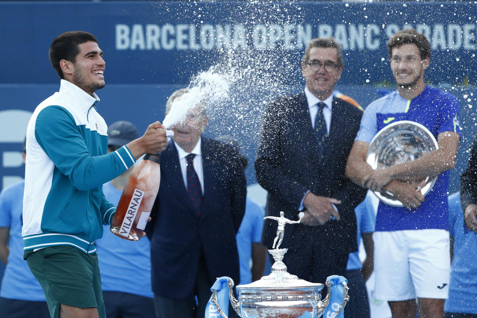 Spain's Carlos Alcaraz celebrates after winning the ATP Godo Tournament final tennis match against Spain's Pablo Carreno Busta, in Barcelona, Spain, Sunday, April 24, 2022. (AP Photo/Joan Monfort)