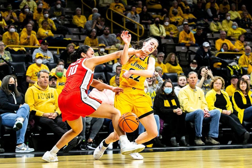 Iowa guard Caitlin Clark, right, gets tangled up with Ohio State guard Braxtin Miller (10) during a NCAA Big Ten Conference women's basketball game, Monday, Jan. 31, 2022, at Carver-Hawkeye Arena in Iowa City, Iowa.

220131 Ohio St Iowa Wbb 005 Jpg