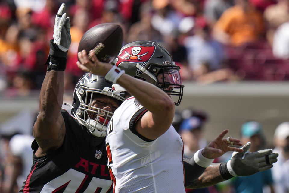 Atlanta Falcons linebacker Bud Dupree (48) pressures Tampa Bay Buccaneers quarterback Baker Mayfield (6) during the first half of an NFL football game, Sunday, Oct. 22, 2023, in Tampa, Fla. (AP Photo/Chris O'Meara)